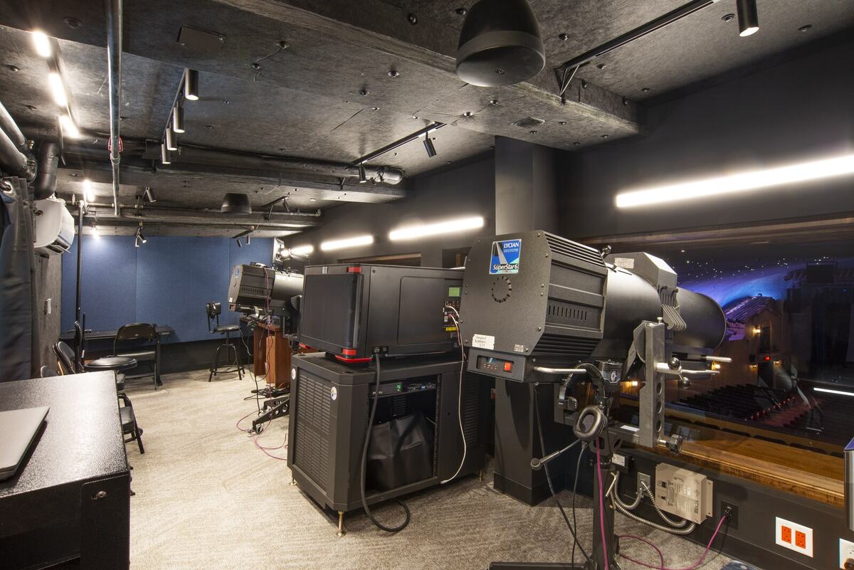 Plaza Theatre technical control room showing modern lighting and projection systems behind the historic renovation